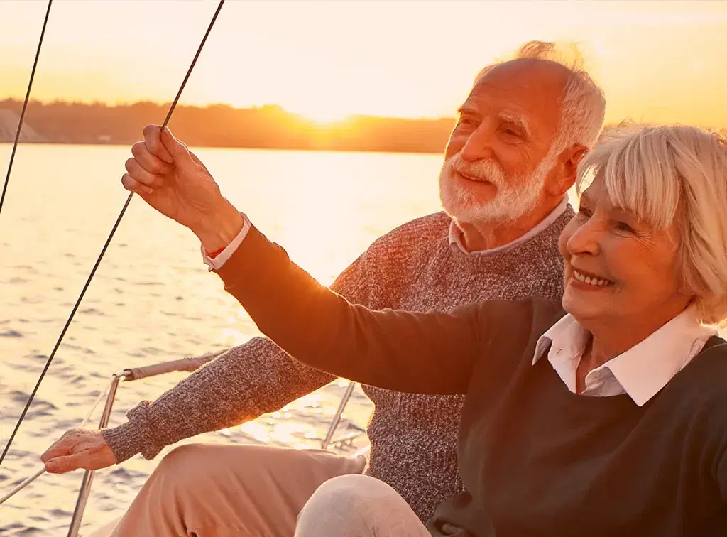 elderly couple sailing on a boat
